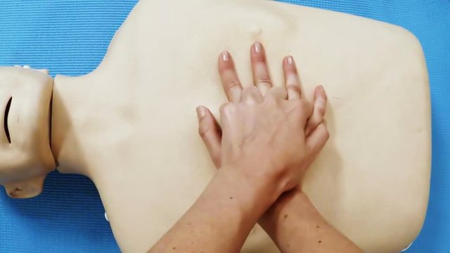 Female paramedic during cardiopulmonary resuscitation training