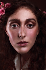 Fototapeta premium Portrait of a beautiful girl with freckles and light wear make up