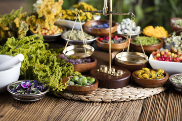 Assorted natural medical herbs and mortar