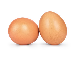Two chicken eggs close-up isolated on white background
