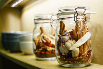 Idea of interior home decoration with grains, herbs bottles