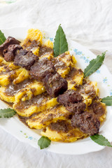 Polenta with wild boar stew