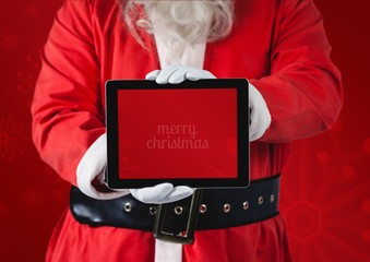 Hands of santa claus holding a digital tablet