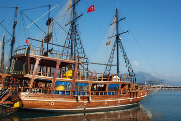Small wooden pirate sailing ship for marine tourist trips along the coast of Alanya. Boat tours is a very popular form of recreation in the Mediterranean.