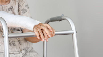 Elderly patient waiting on her walker