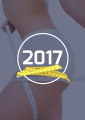 Woman measuring her thigh against 2017