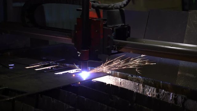Cutting of metal. Sparks fly from plasma and metal interaction