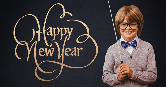 Smiling boy with stick standing next to happy new year wishes
