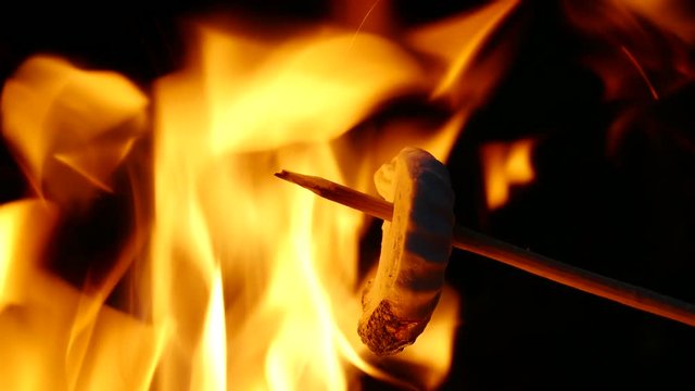 4K . Marshmallows At Camp Fire, bonfire. Macro view