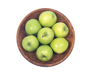 Green organic granny smith apples in wooden bowl isolated on white background