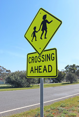 black and yellow children crossing ahead sign