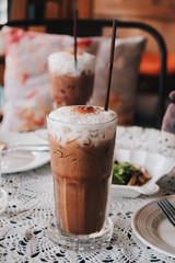 Glass of Cold Iced Mocha Coffee in the Coffee shop, Vintage tone