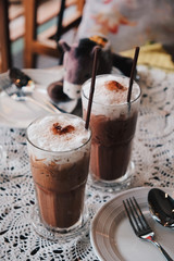 Glass of Cold Iced Mocha Coffee in the Coffee shop, Vintage tone