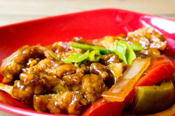 wok fried chicken stir fry with sweet peppers and chinese vegeta