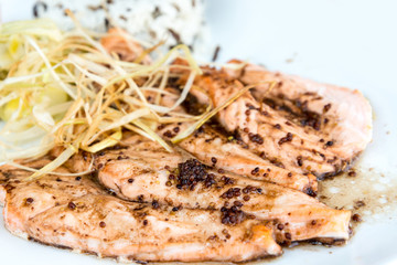 grilled salmon and lemon - french cuisine dish with tomato and s