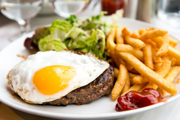 Egg and fries - classical english breakfast with egg and fries