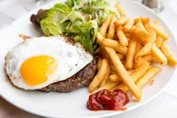 Egg and fries - classical english breakfast with egg and fries
