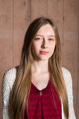Closeup of a beautiful teen girl in Red top with white cardigan