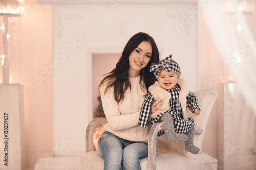 Smiling Young Mother Holding Her Little Baby Girl Under 1 Year Old