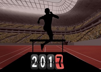 Composite image of 2017 with silhouette of an athlete jumping ov