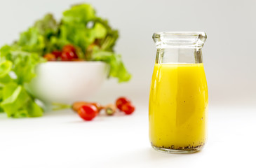 basic salad dressing made with olive oil lemon juice honey salt and black peppers.
