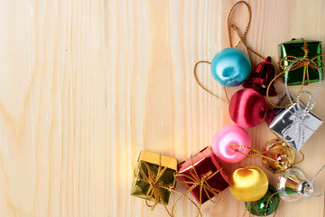 christmas gifts decoration on antique rustic wooden background; above view looking down with wood , top view with wood copy space