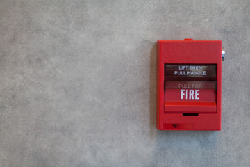 Fire Alarm. Red fire alarm system on grey wall