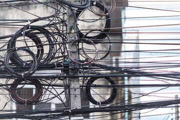 Electrical network and internet wire.Tangled wiring electrical in Bangkok city.