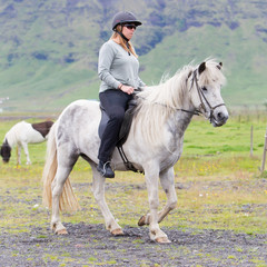 Woman riding a horse