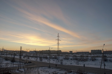 View from the window to the industial street in the winter frosty morning. North