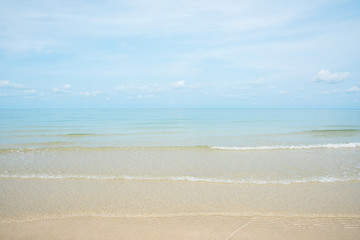 Fototapeta na wymiar Beautifull gentle wave and shore break at the sandy beach