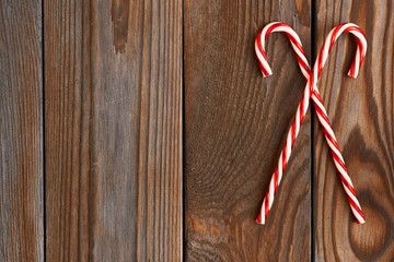 Christmas cane on wooden background