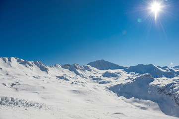 Alpine winter mountain landscape. French Alps with snow.