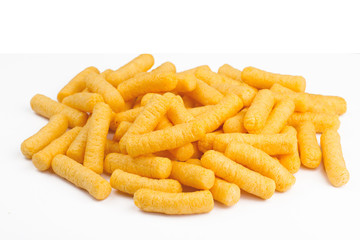 side view of corn puff snacks pile isolated on white - obrazy, fototapety, plakaty