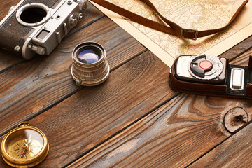 Vintage camera and lens on antique XIX century map