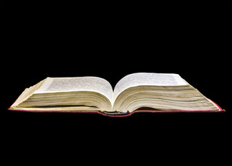 Old book on black background