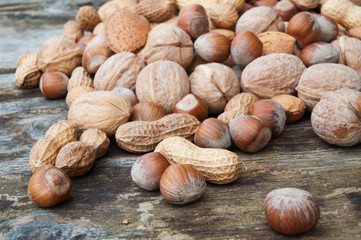 Assorted nuts on wood