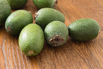 Feijoa fruit on wooden background