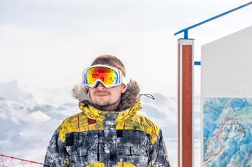Young man in ski goggles outdoors