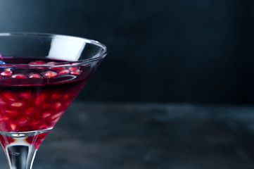pomegranate cocktail and ripe red pomegranate fruit