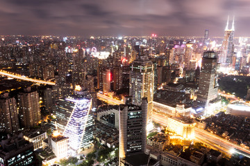 Obraz premium modern office buildings in shanghai at night