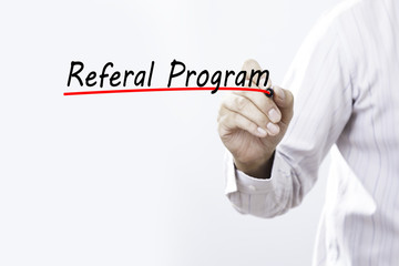 Businessman hand writing Referral Program with marker, Business