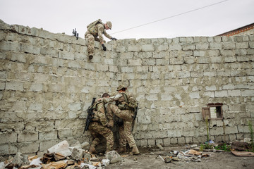 rangers team climbing from a wall