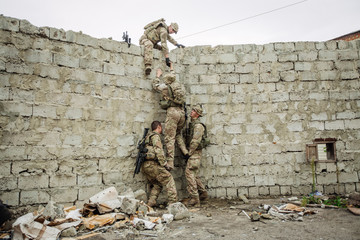 rangers team climbing from a wall