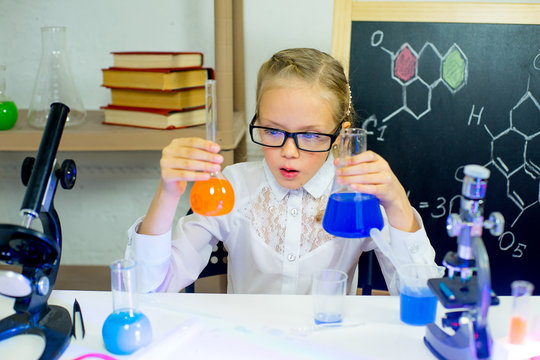 young girl making science experiments