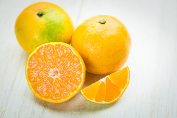 oranges on old wooden table,close up photo..