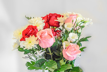 Bouquet with colored rose flowers, eustoma and chrysanthemums