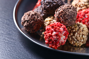 Homemade candy with chocolate , nuts and dried strawberry