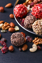 Homemade candy with chocolate , nuts and dried strawberry