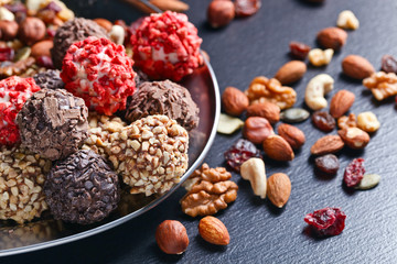 Homemade candy with chocolate , nuts and dried strawberry